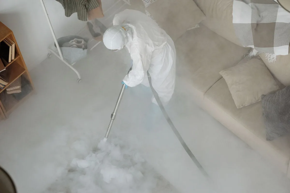 Biohazard cleanup technician in protective equipment, Clarksdale, MS